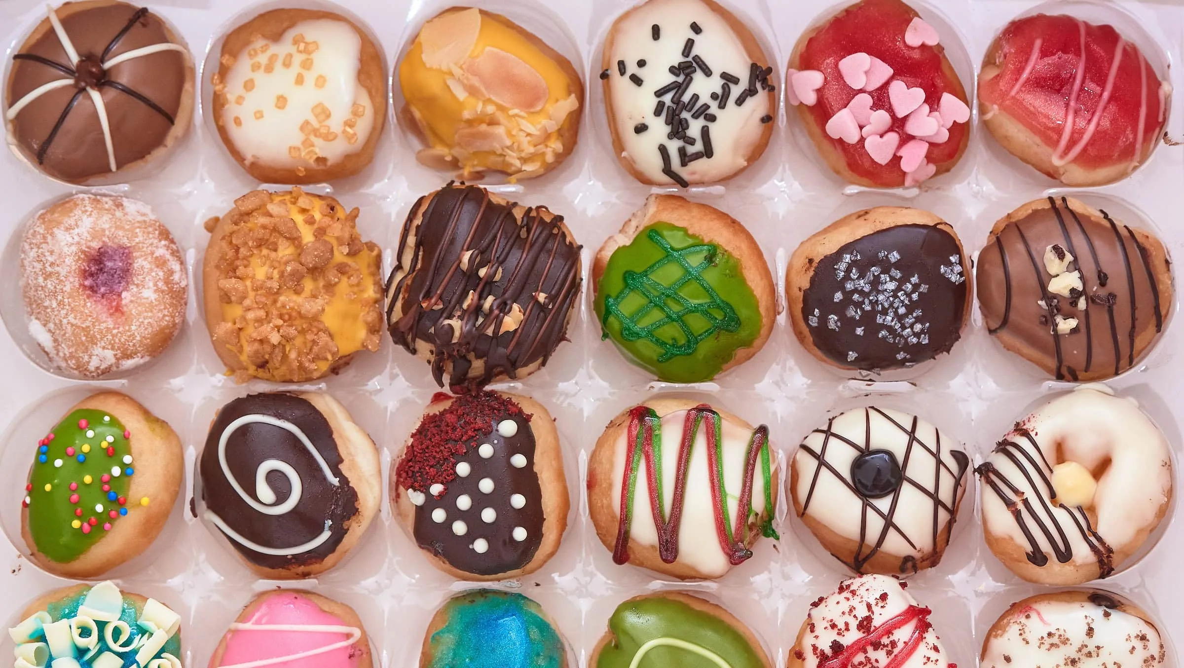 Rows of tasty doughnuts in a box