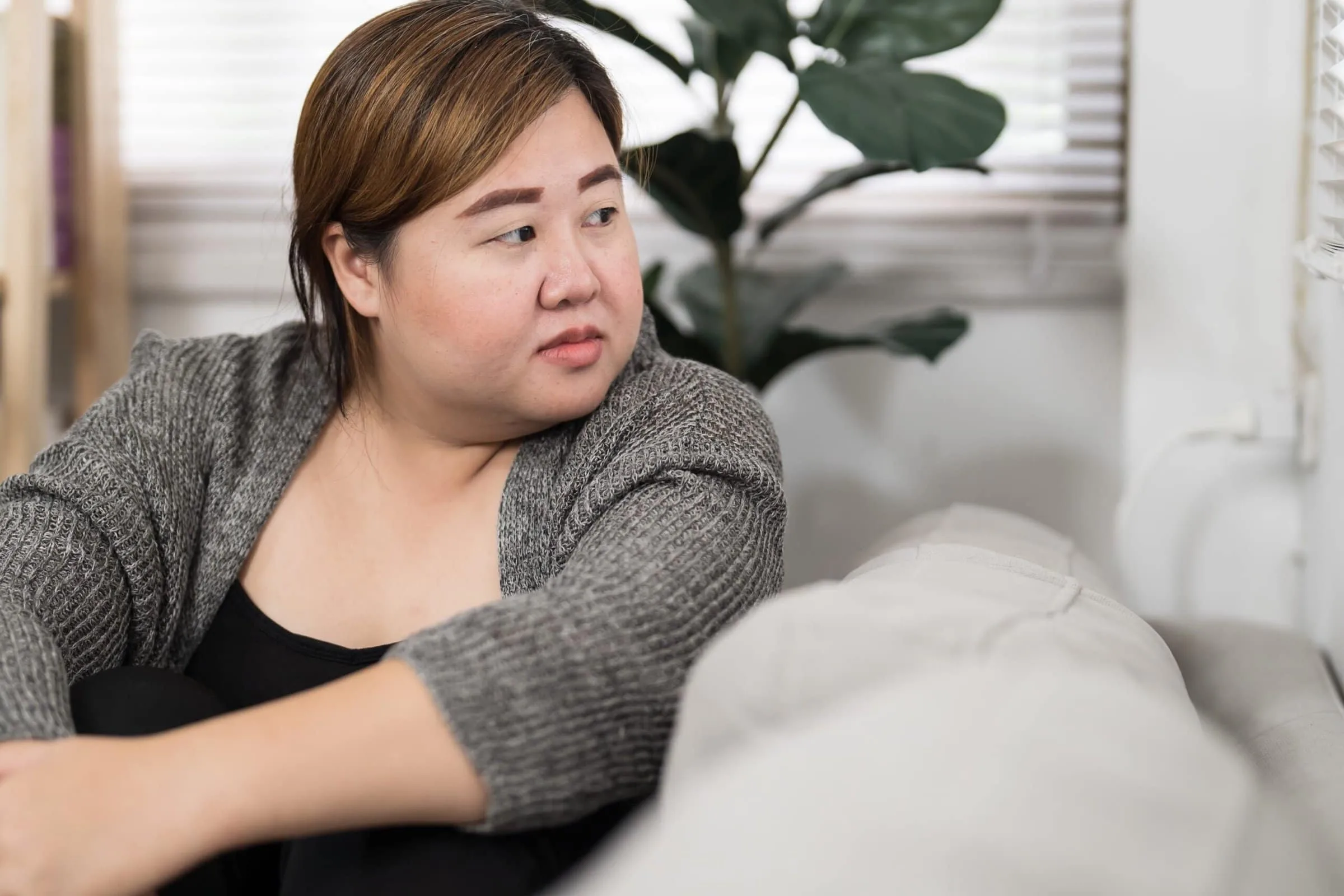 Sad,Overweight,Plus,Size,Woman,Thinking,About,Problems,On,Sofa